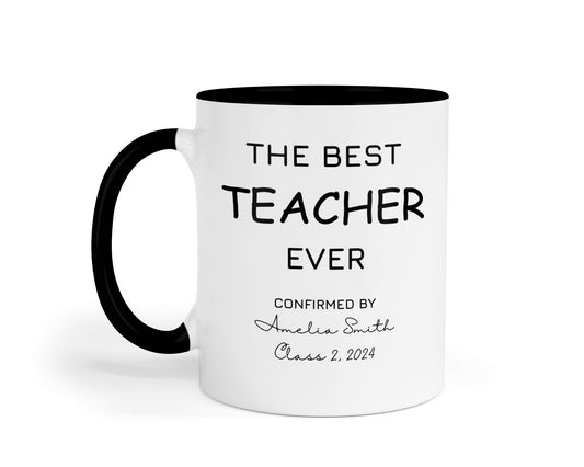 A white ceramic mug with a black handle and black interior. The mug features the phrase "THE BEST TEACHER EVER" in bold black text. Below, in smaller script and print, it reads "CONFIRMED BY Amelia Smith Class 2, 2024."