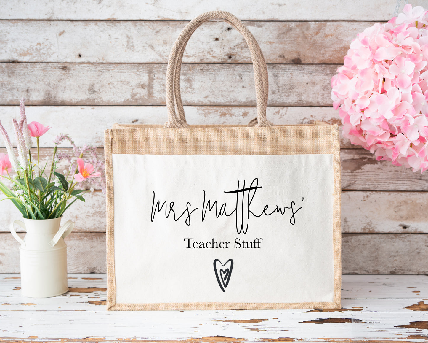 Medium-sized personalised jute tote bag with “Mrs Matthews’ Teacher Stuff” printed in black, eco-friendly and perfect for classroom essentials.