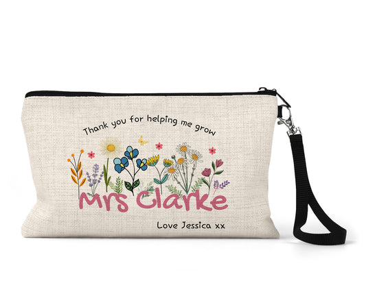 Personalised Teacher Pencil Case featuring a flower motif, with the saying 'Thank you for helping me grow'.
Personalised with any Teachers name and message for the bottom of the pencil case.