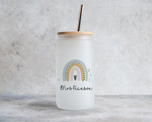 Unique personalised glass tumbler with straw – frosted glass teacher gift featuring a blue and mustard rainbow design with name "Mrs Hanson", bamboo lid and metal straw included.