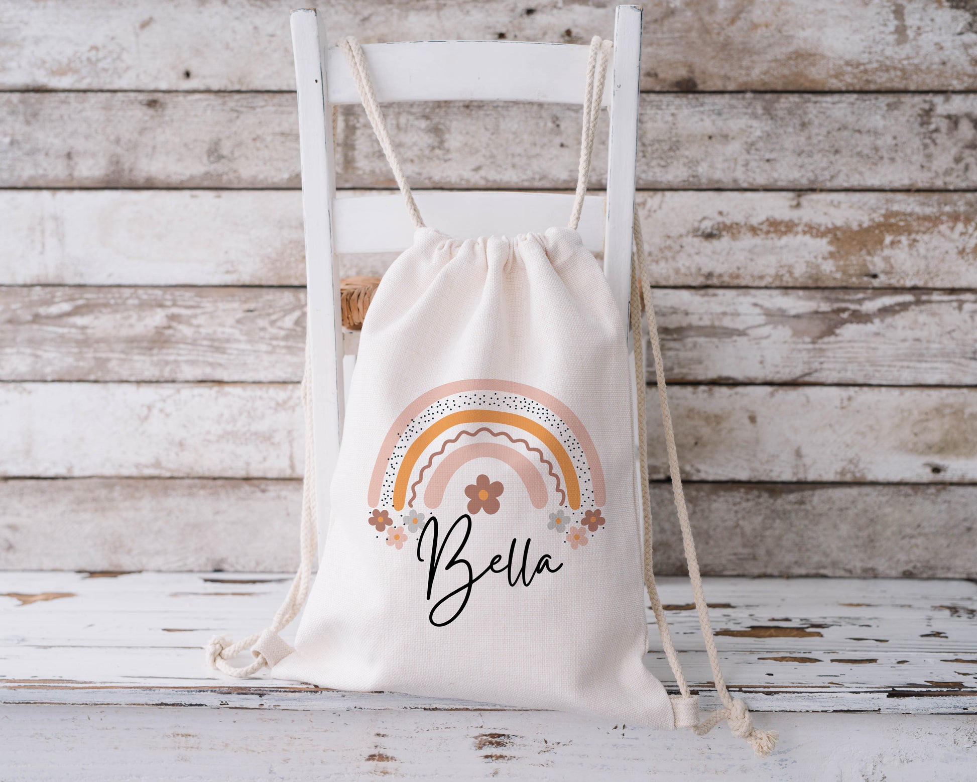 Personalised rainbow drawstring bag for girls with name Bella, pastel boho design on cotton gym sack, custom kids school PE or nursery backpack