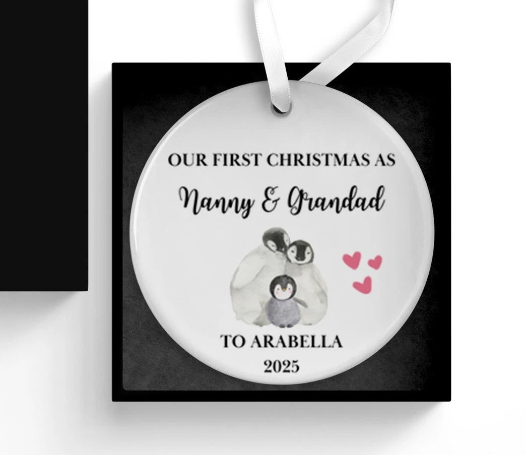Personalized Christmas ornament with penguins and text on a white background