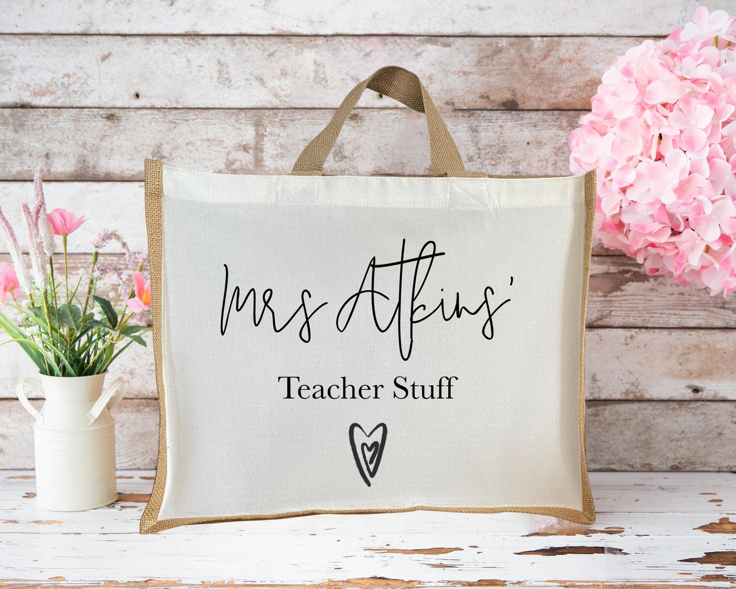 Custom medium teacher jute bag featuring “Mrs Atkins’ Teacher Stuff” and a heart design, ideal personalized gift for teachers or teaching assistants.