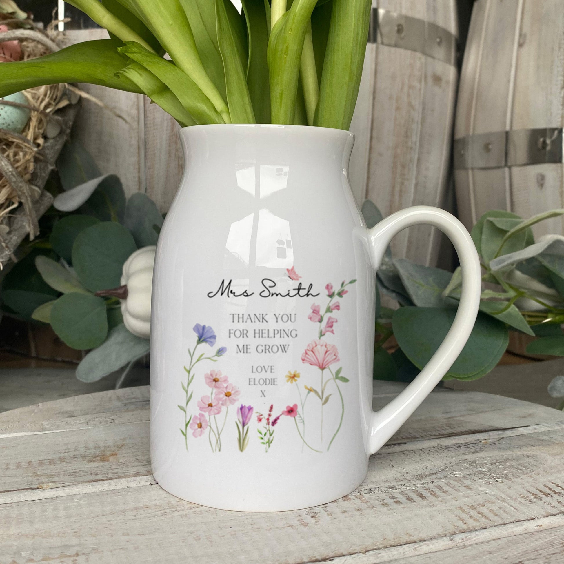 Personalised small flower vase for Teachers. Featuring the saying 'Thank you for helping me grow' and personalised with a name and who it's from.