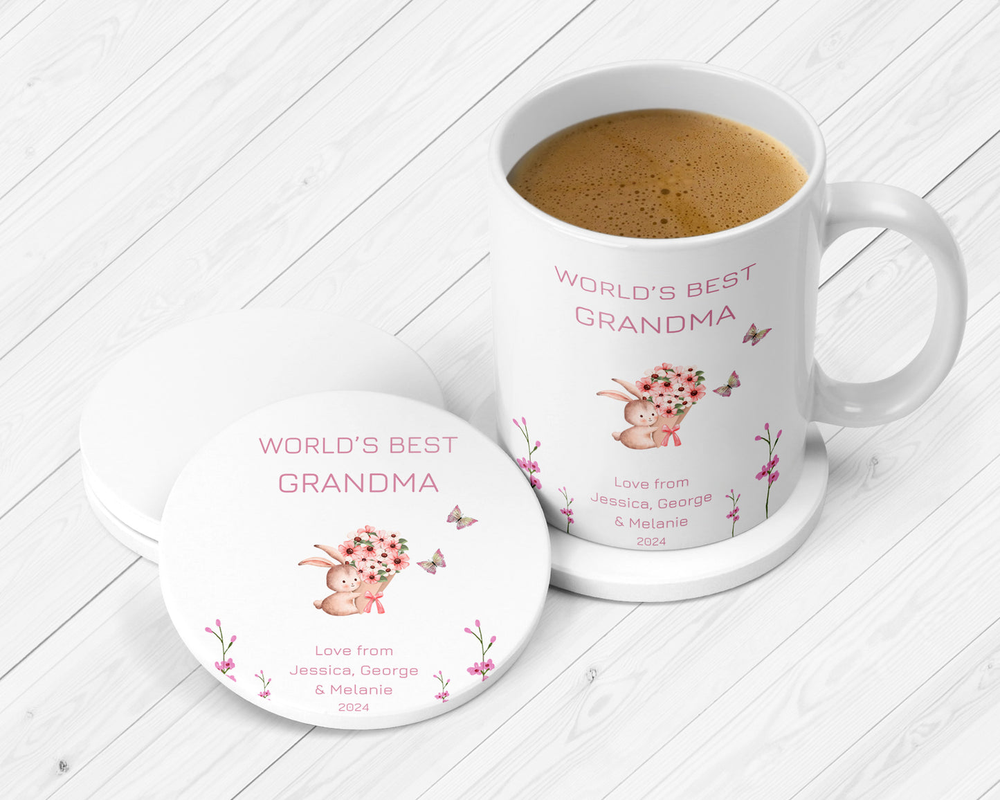 Personalised “World’s Best Grandma” mug and coaster gift set featuring a cute bunny holding a bouquet, butterflies, and custom message from Jessica, George & Melanie. Perfect Mother’s Day or birthday present for nan in 2024.