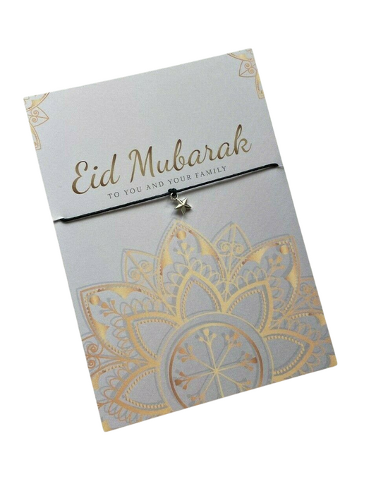 A bracelet card with 'Eid Mubarak' written on it, alongside a silver-plated Tibetan bracelet, both presented on a clear cellophane pouch.
