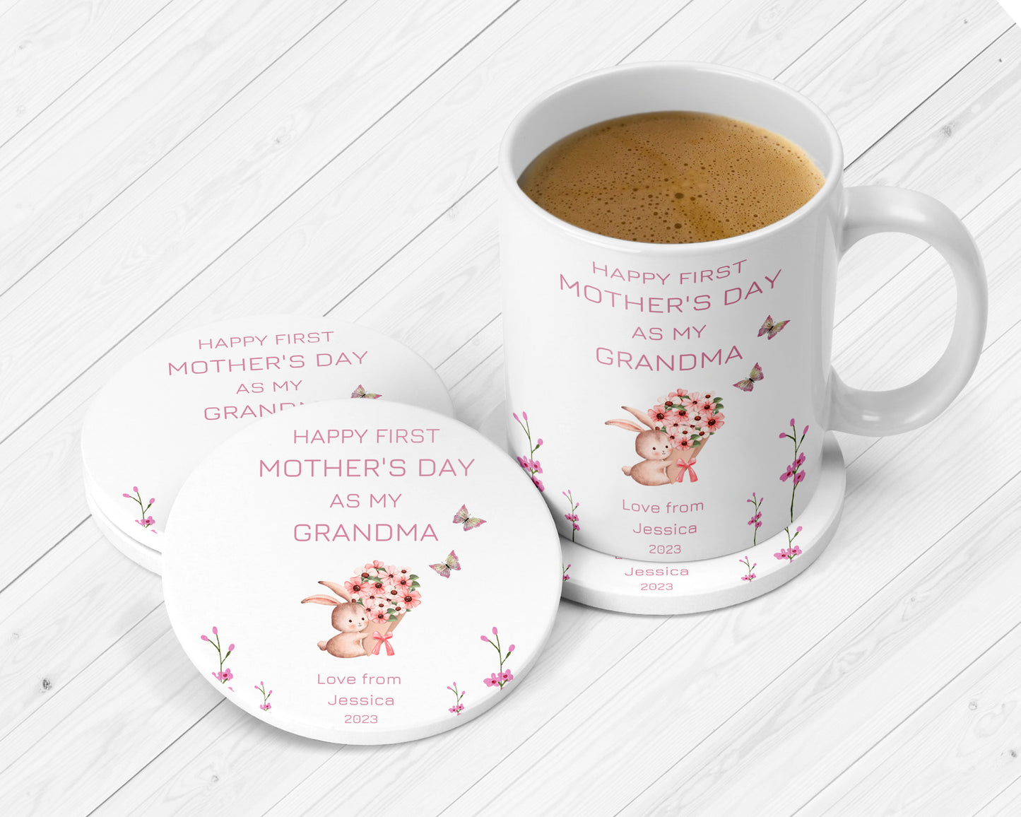 Custom gift set for a nanny’s first Mother’s Day, including a white mug and coasters printed with a pink-themed message and cute bunny holding flowers. Embellished with butterflies and botanical motifs.