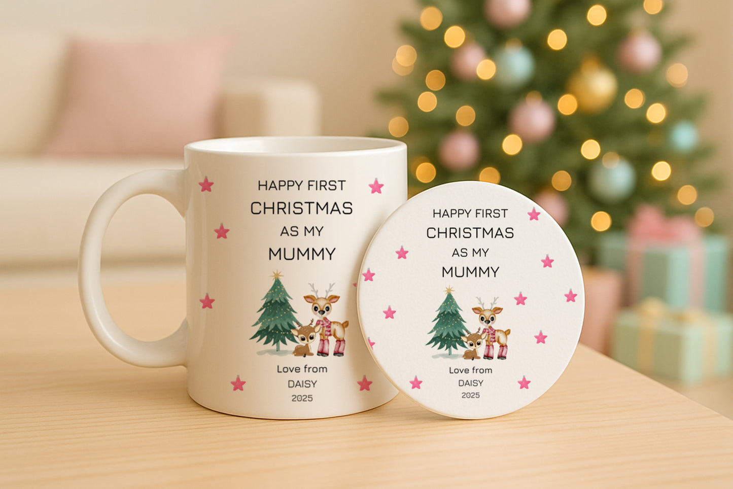 Mug and coaster set with First Christmas design and text on a table with a blurred festive background