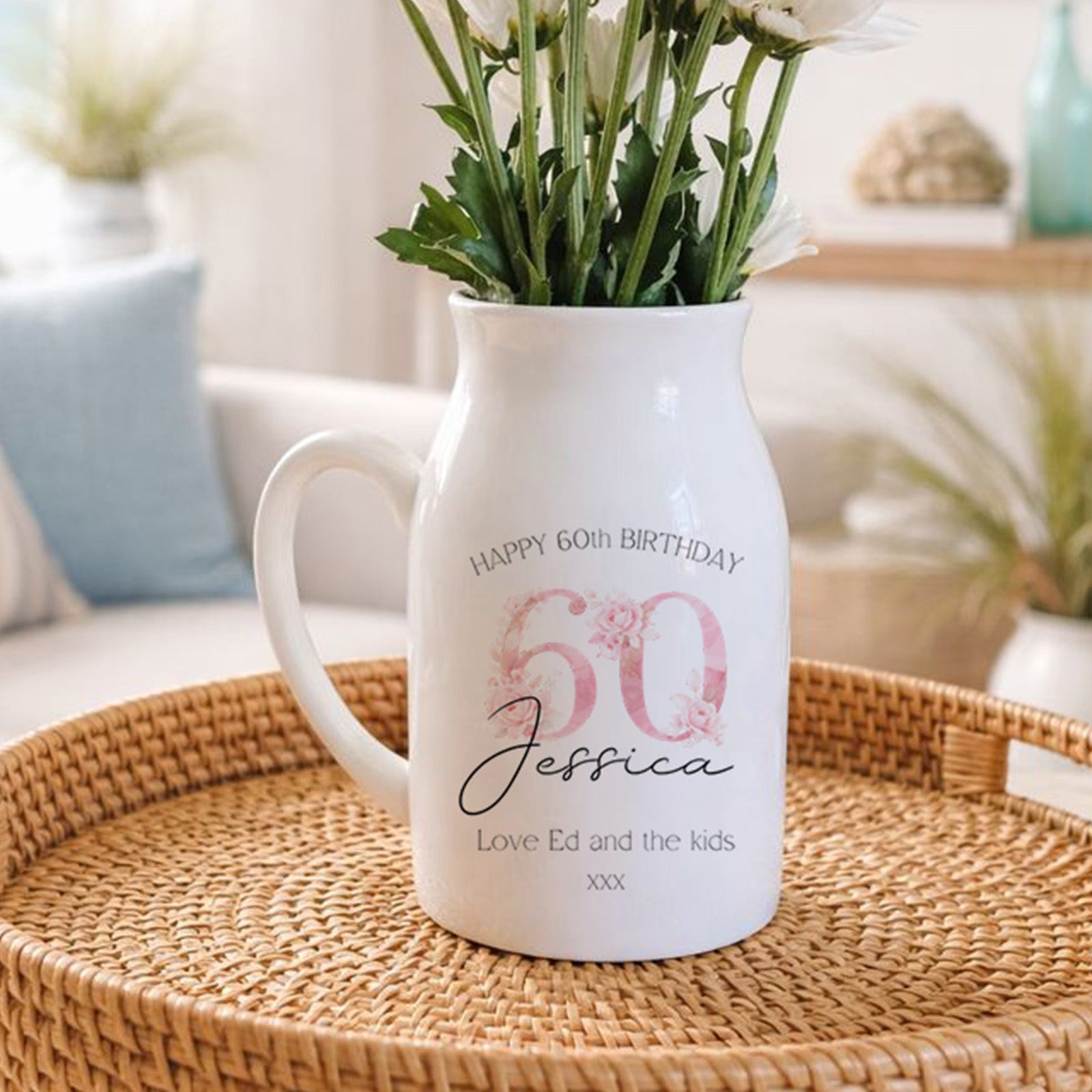 White pitcher vase with floral 60th birthday personalised design and text on a woven tray