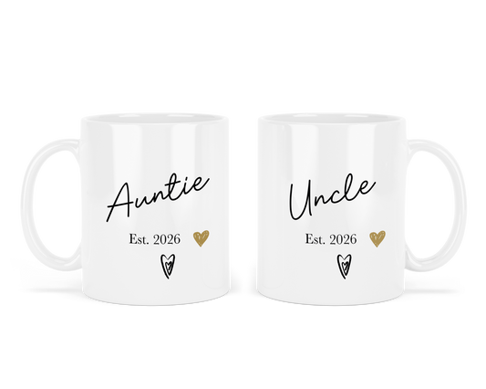 Two personalised white mugs with 'Auntie Est. 2026' and 'Uncle Est. 2026' text on a white background