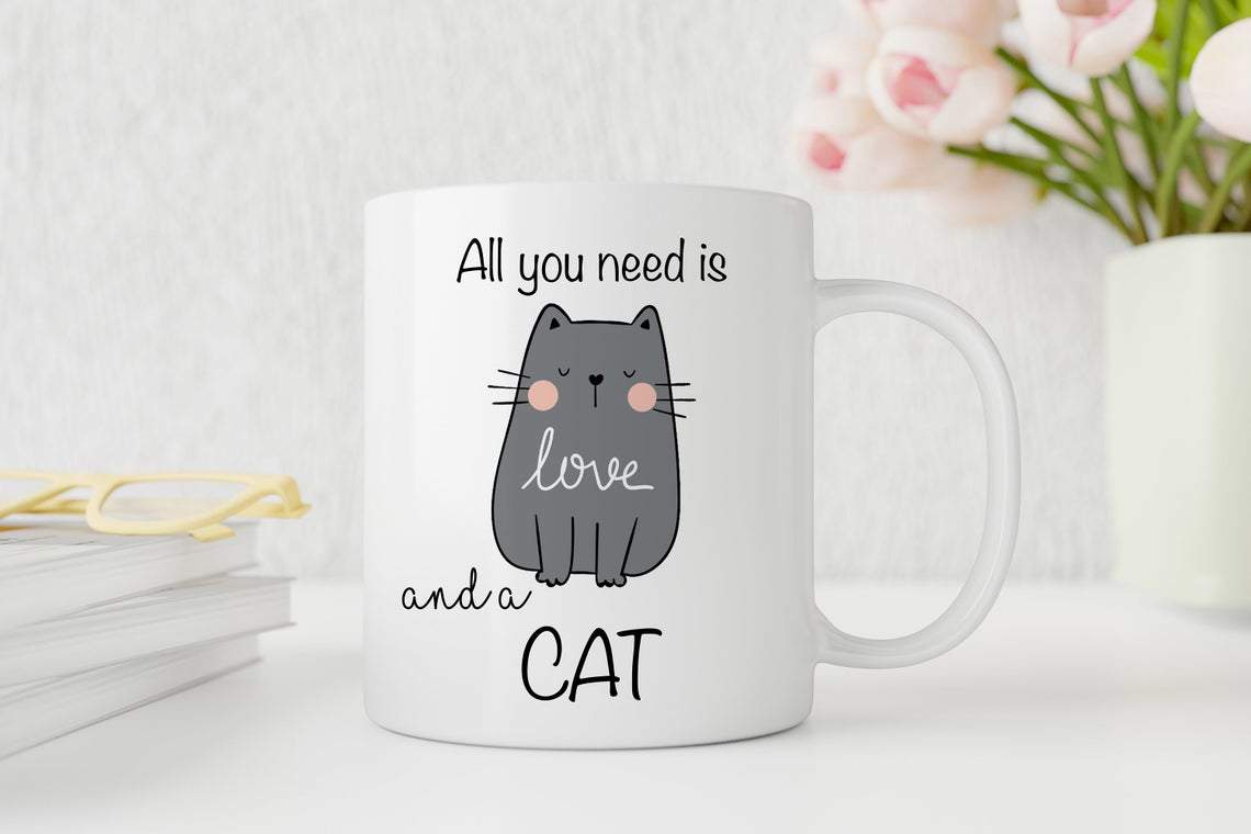 White mug with a cat illustration and text on a light background