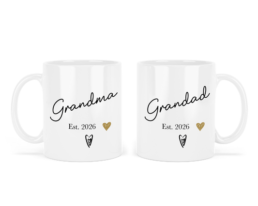 Two personalised white mugs with 'Grandma Est. 2026' and 'Grandad Est. 2026' text on a white background