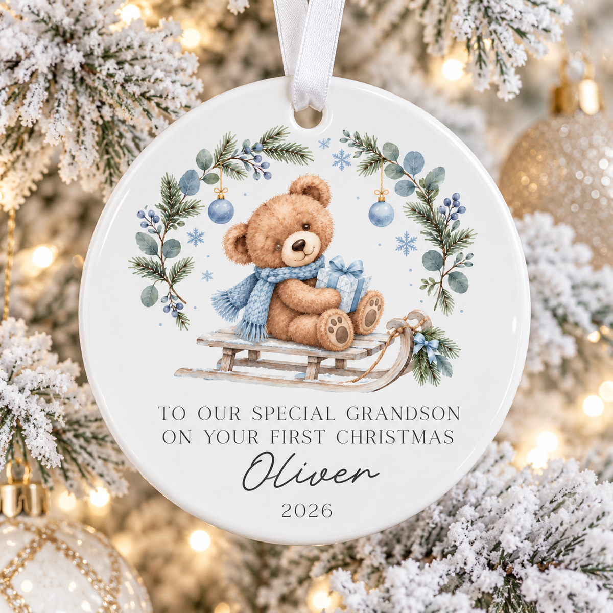 Personalised Grandson's First Christmas Bauble 2026 with a sweet teddy bear design and custom name. A ceramic Christmas keepsake to treasure.
