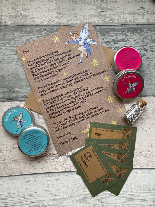 Personalised Tooth Fairy Kit. Set of tins, cards, and a letter on a wooden surface