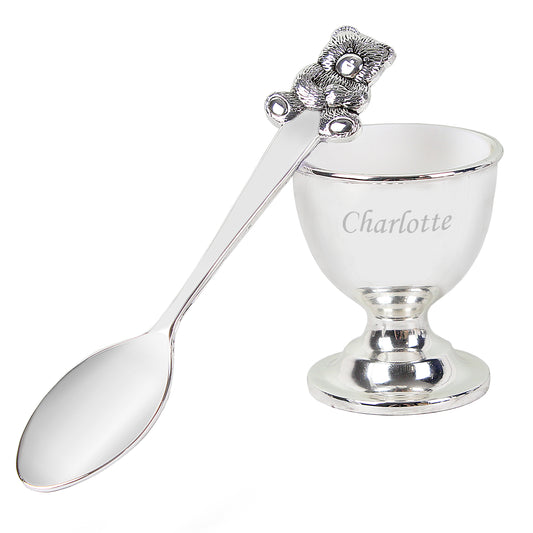 Personalised Silver egg cup with spoon and decorative handle on a white background