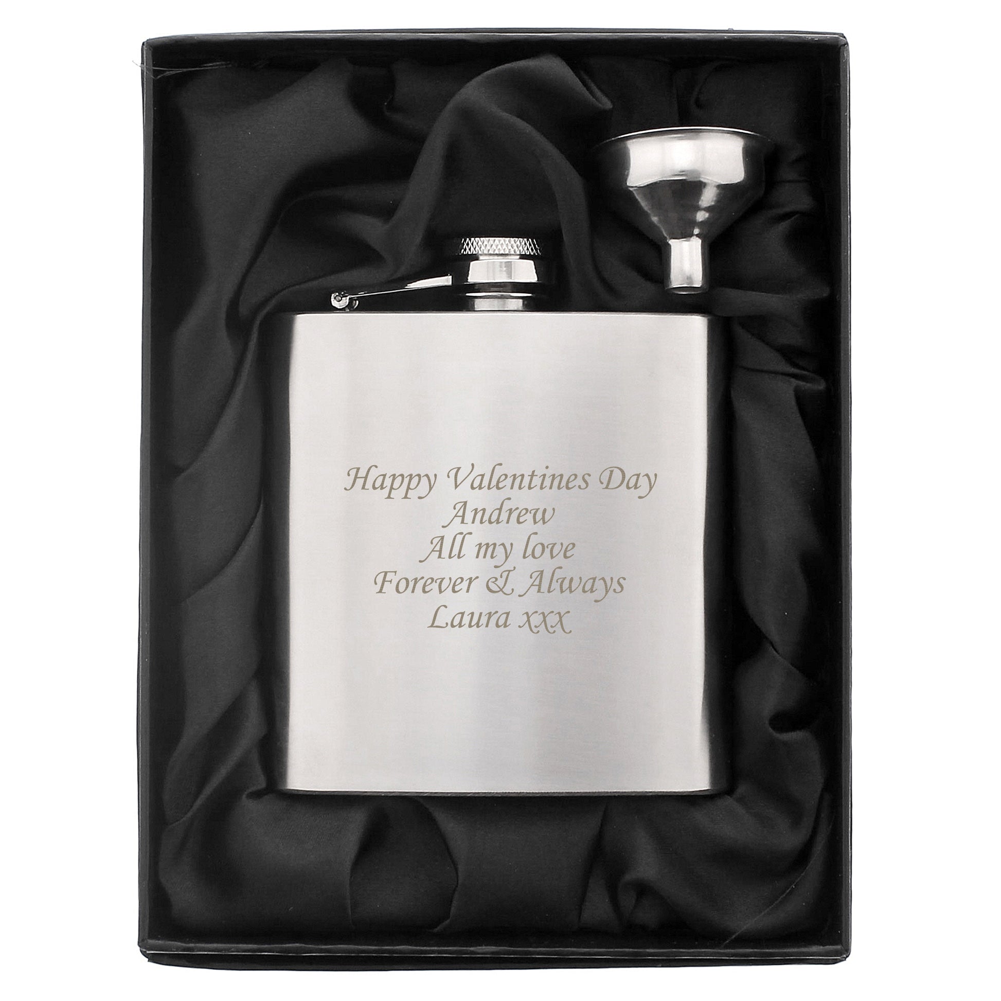 Silver hip flask with engraved message in a black satin-lined box