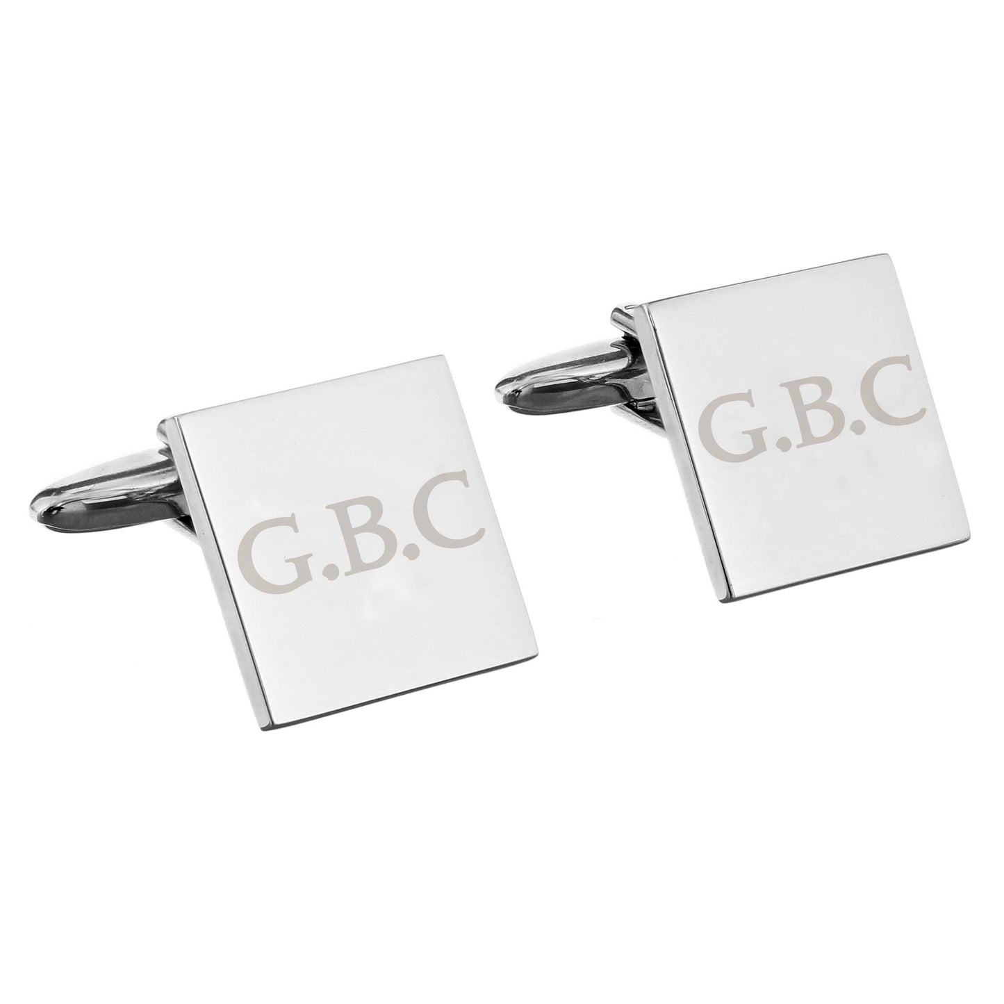 Square cufflinks with 'G.B.C.' engraving on a white background