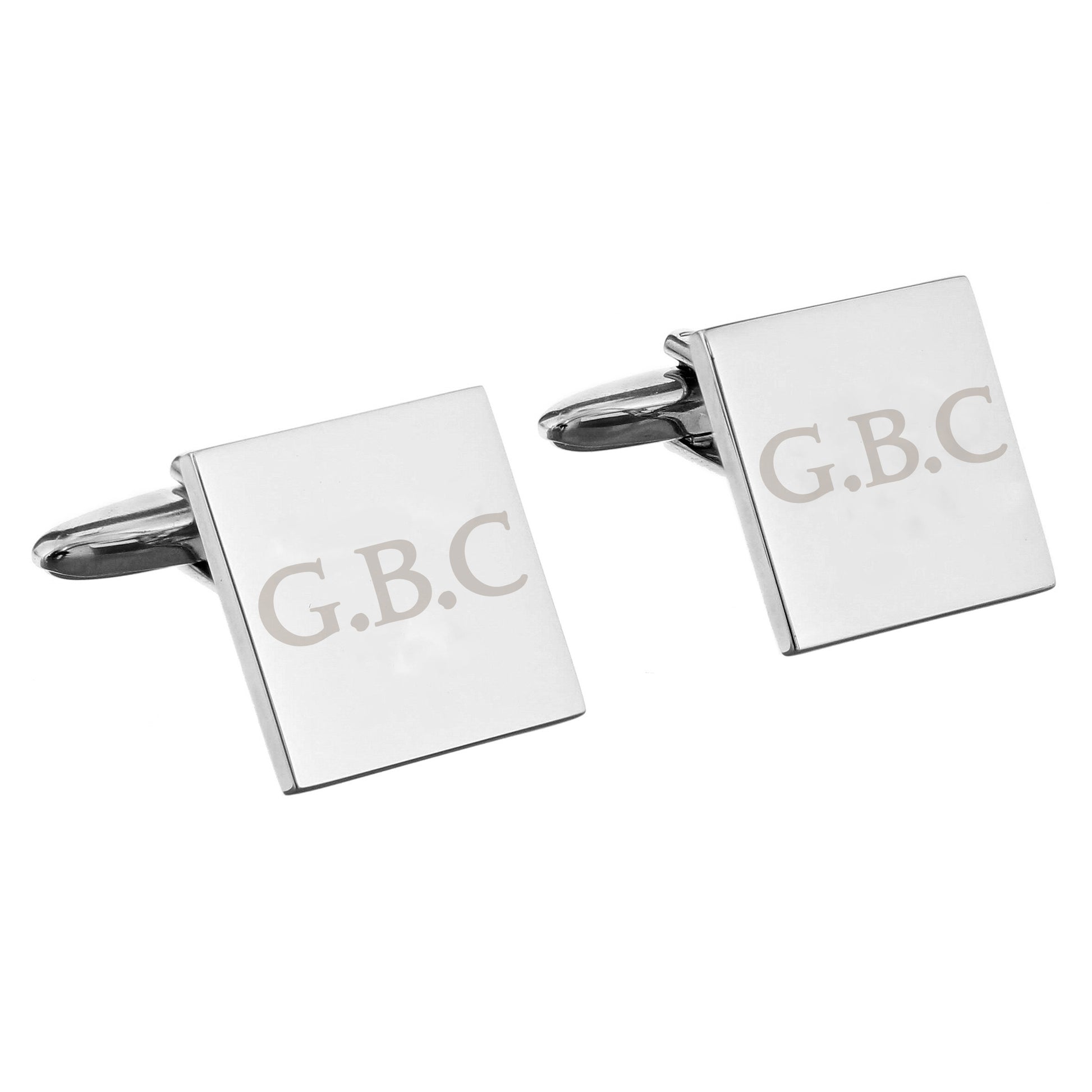 Square cufflinks with 'G.B.C.' engraving on a white background