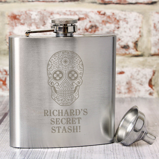 Personalised Stainless steel flask with sugar skull design and 'Richard's Secret Stash!' text, on a textured surface.