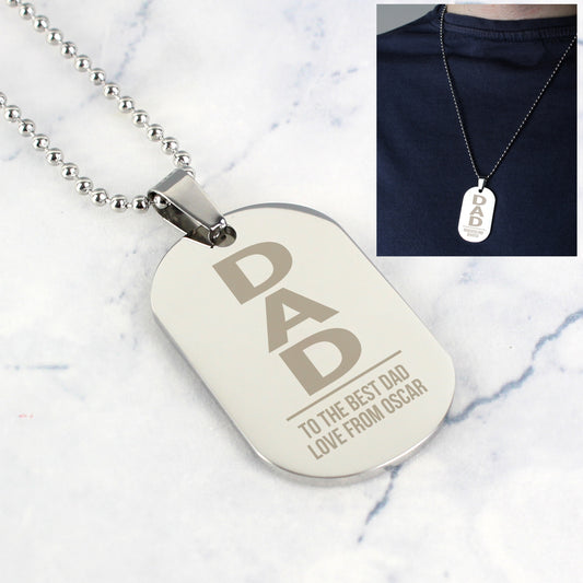 Personalised Dog tag necklace with 'DAD' engraving on a marble surface