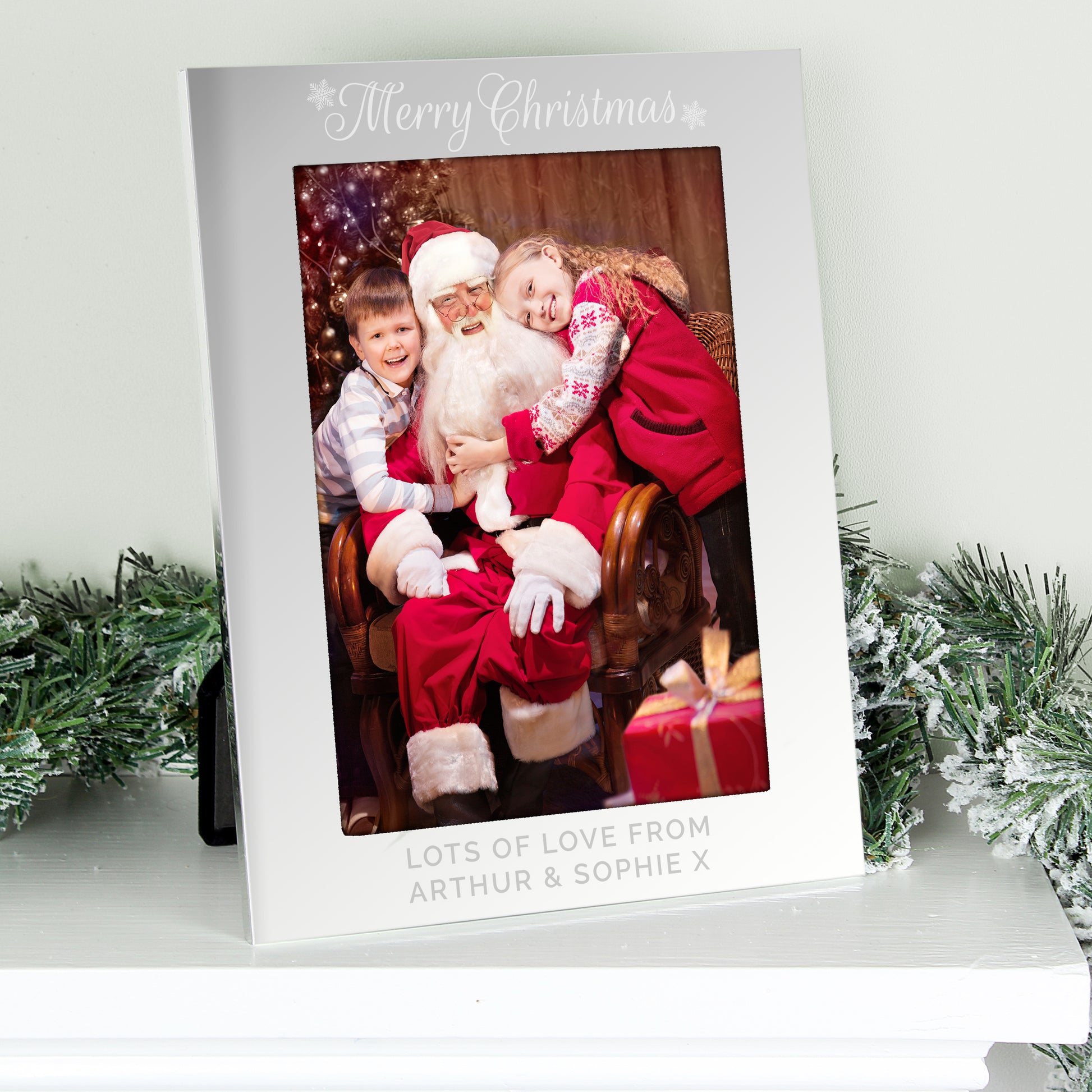 Personalised Christmas card with a photo of Santa Claus and two children, surrounded by festive decorations.