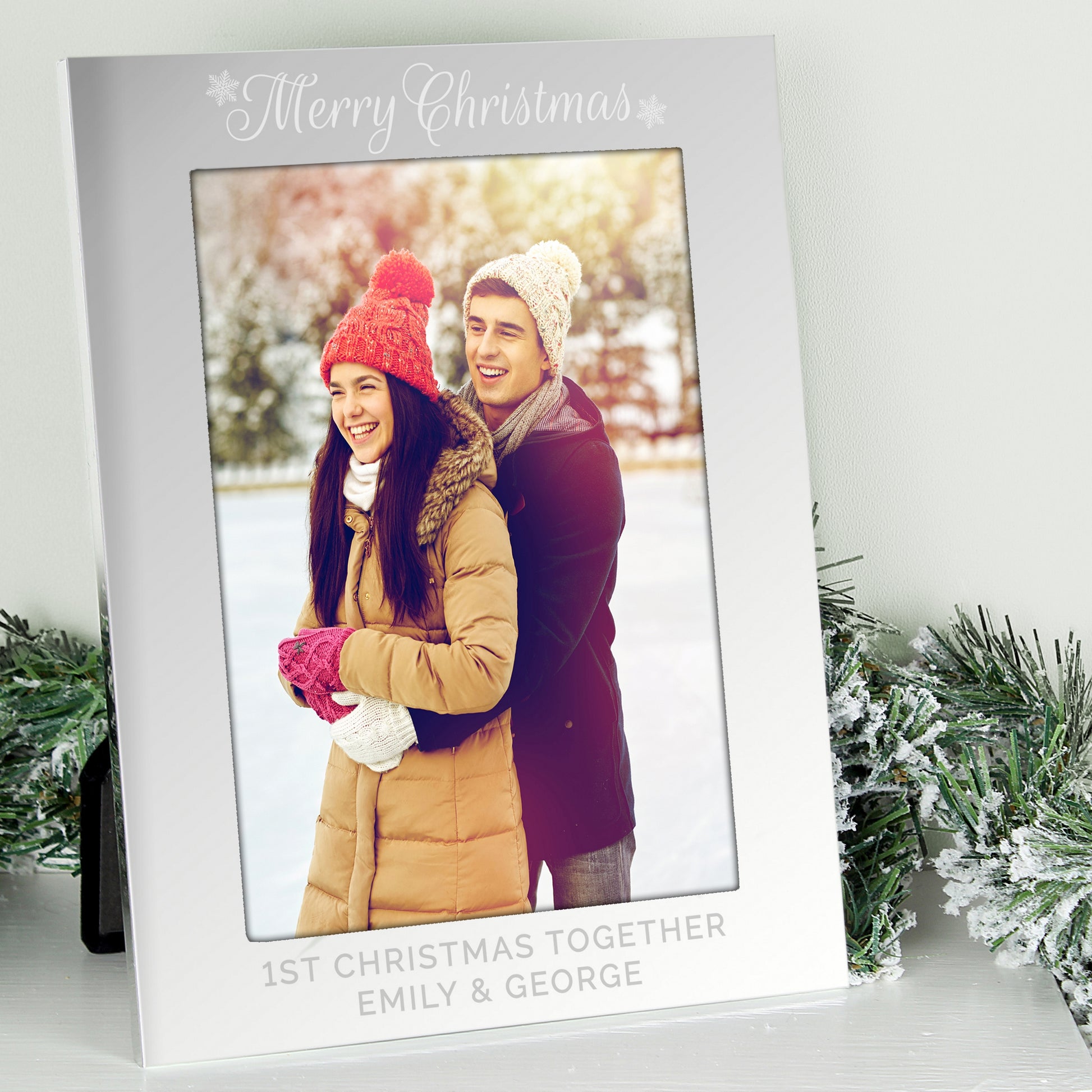 Personalised photo frame with a couple's photo and 'Merry Christmas' text, surrounded by festive decorations.
