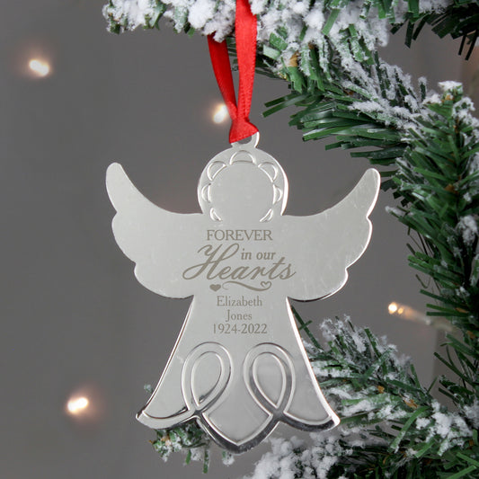 Personalised Silver angel ornament with 'Forever in our Hearts' text on a Christmas tree.