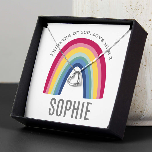 Necklace with heart pendant in a box featuring a rainbow design and personalised ext.