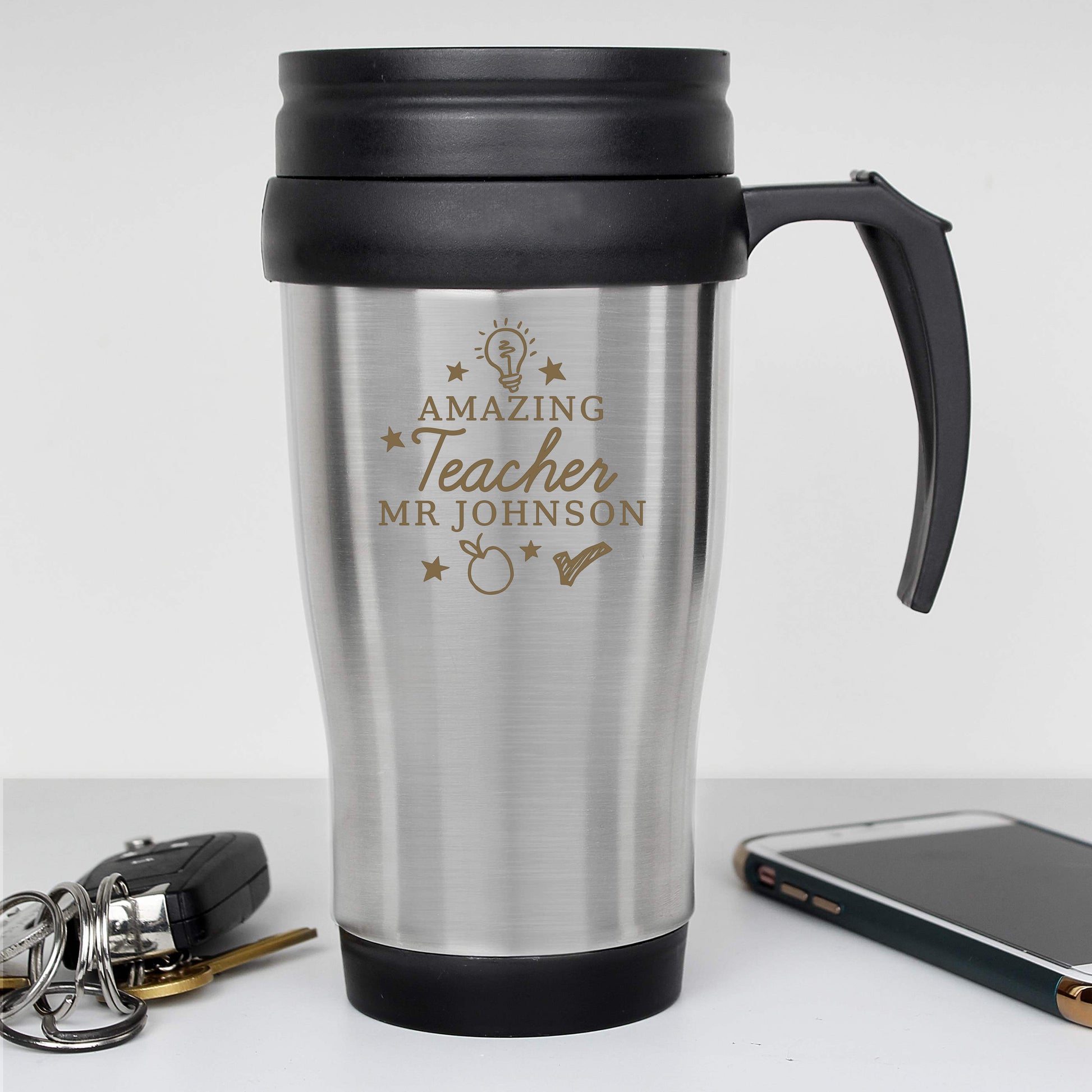 Silver travel mug with black handle and lid, featuring 'Amazing Teacher Mr Johnson' text on a white background.