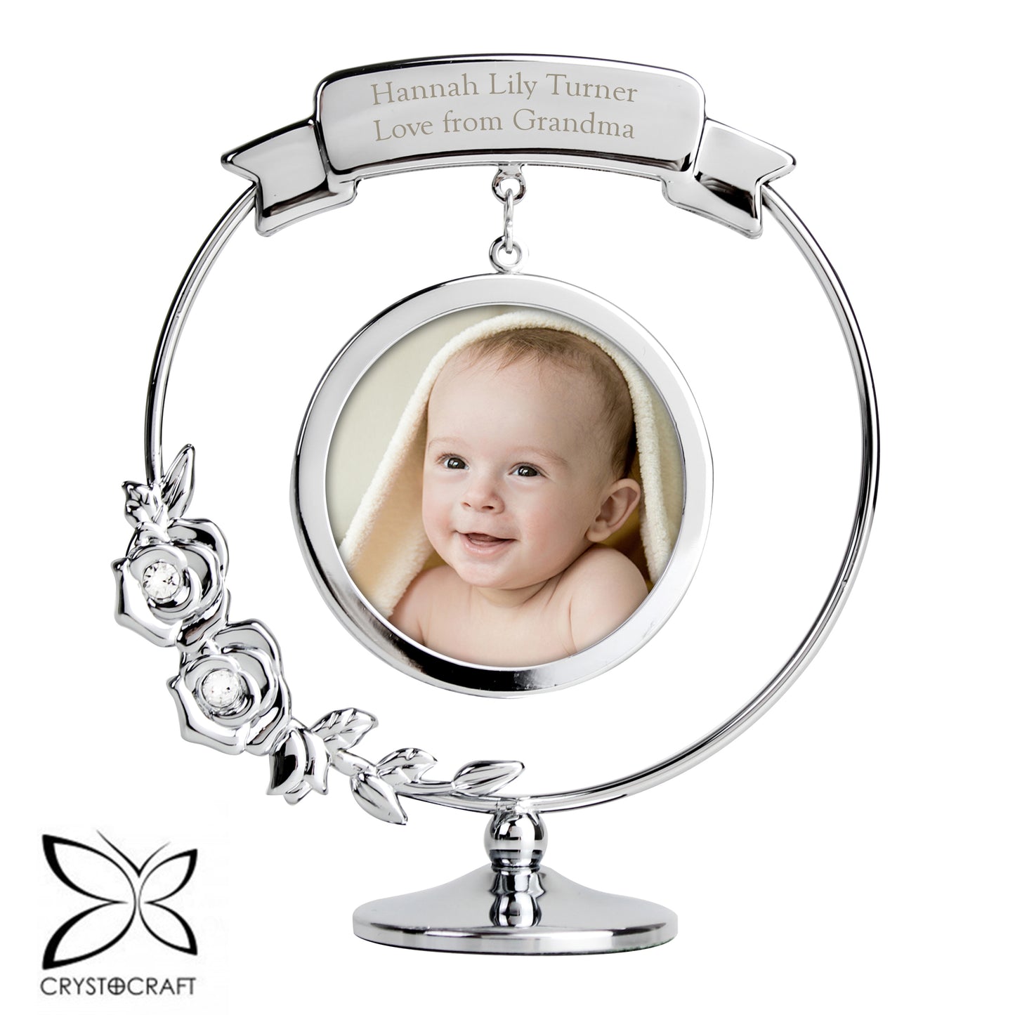 Silver photo frame with a baby's picture and 'Love from Grandma' text, featuring Crystocraft logo.