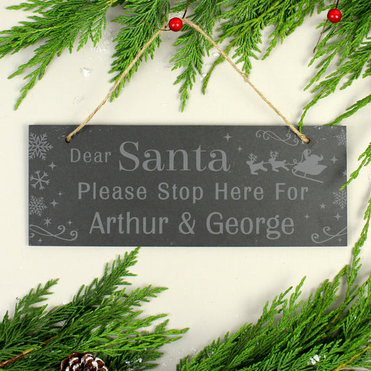 Personalised Christmas sign with pine branches on a white background