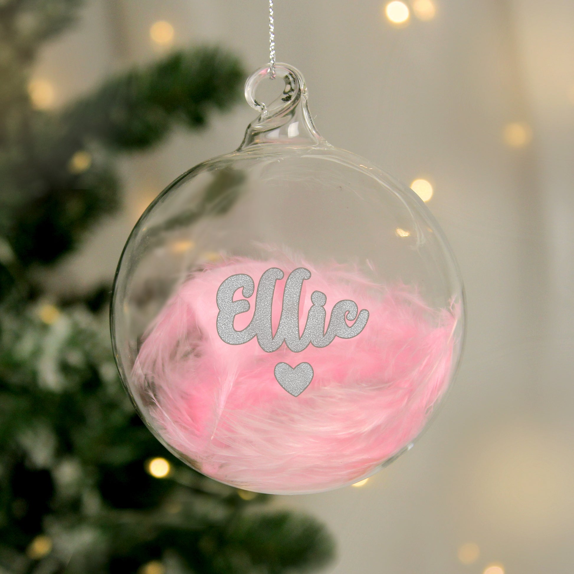 Clear Christmas ornament with pink feather
