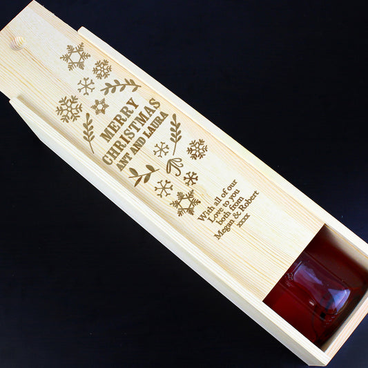 Wooden gift box with engraved text on a dark background