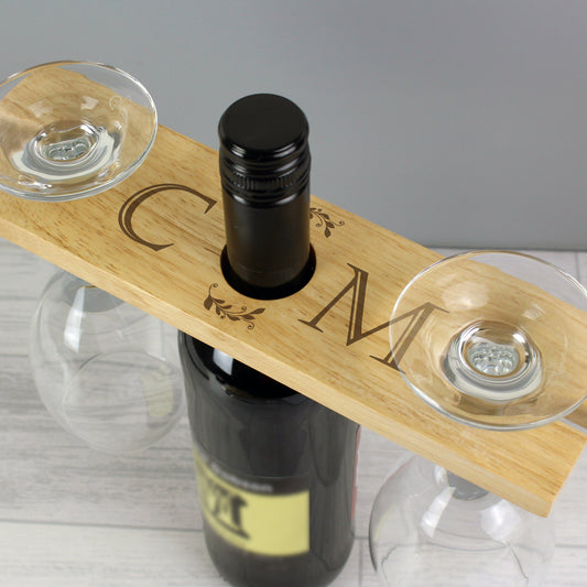 Personalised Wooden wine holder with two glasses and a bottle on a gray background
