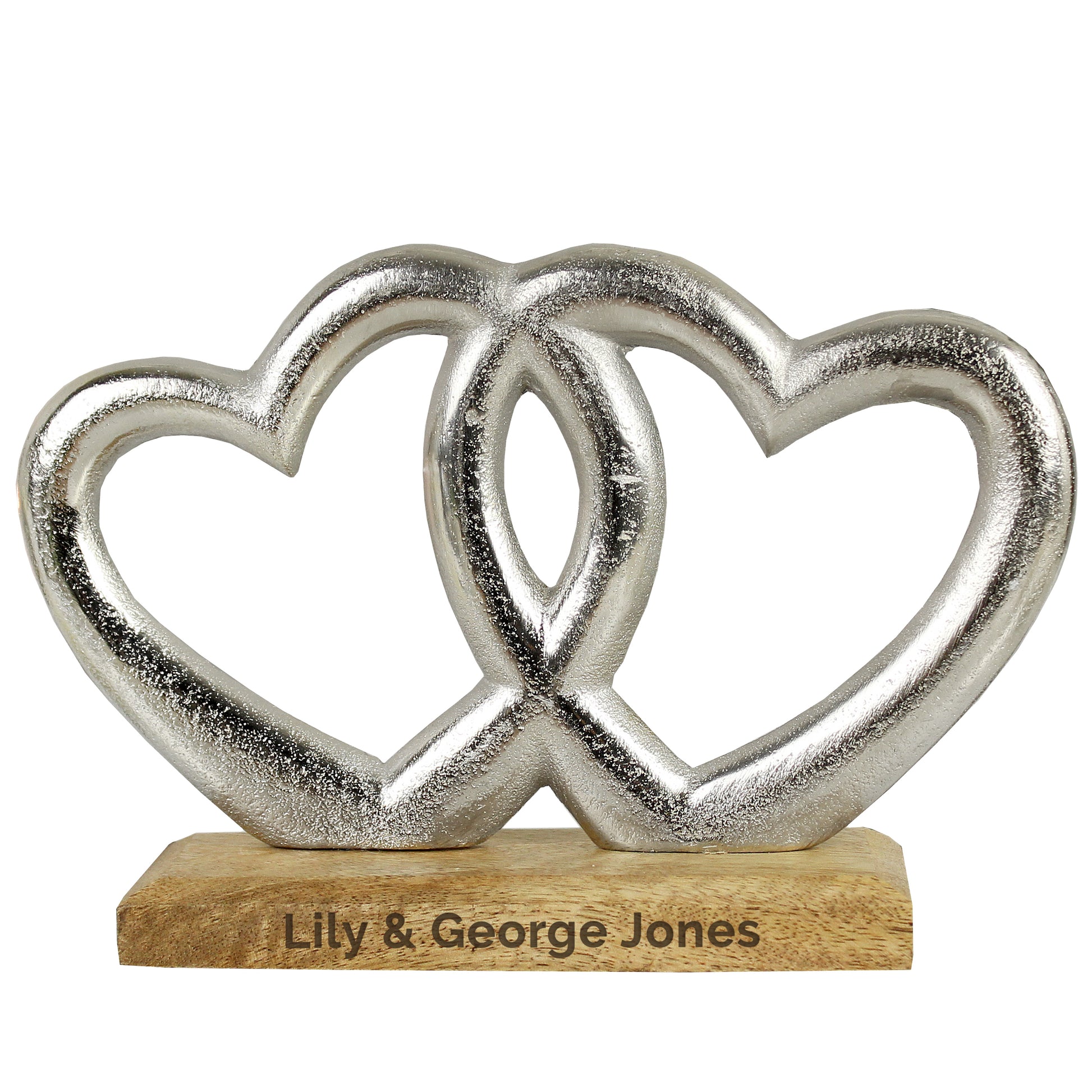 Decorative item with interlocking hearts on a wooden base with engraved text, against a white background