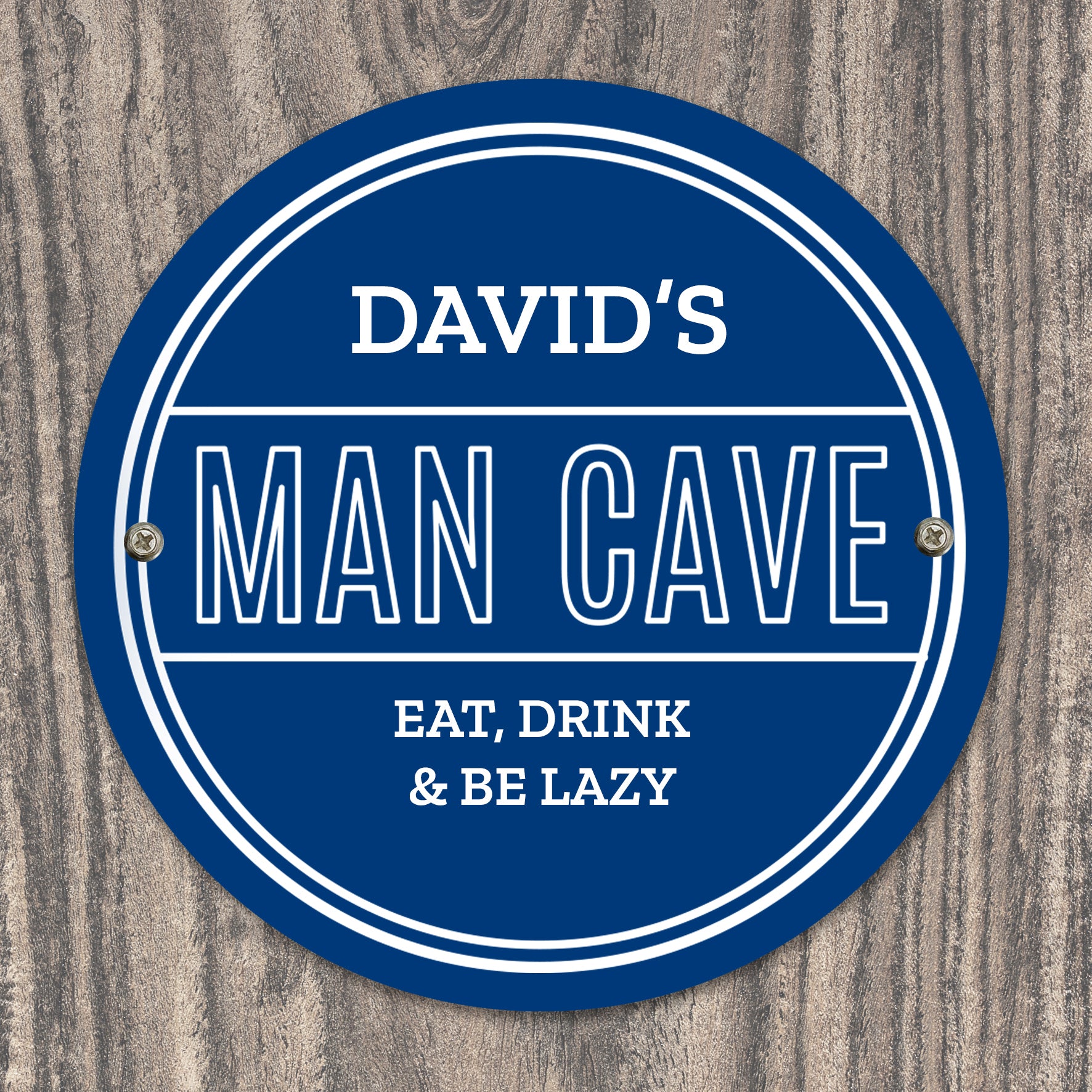 Personalised Circular blue sign with 'DAVID'S MAN CAVE EAT, DRINK & BE LAZY' text on a wooden background