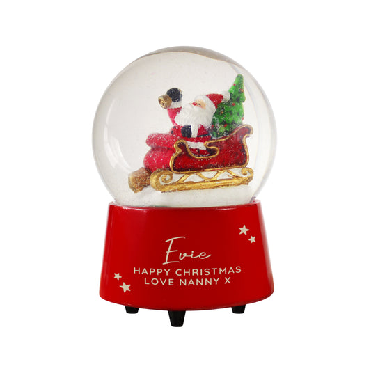 Christmas snow globe with Santa Claus and reindeer on a red base, featuring personalised text.