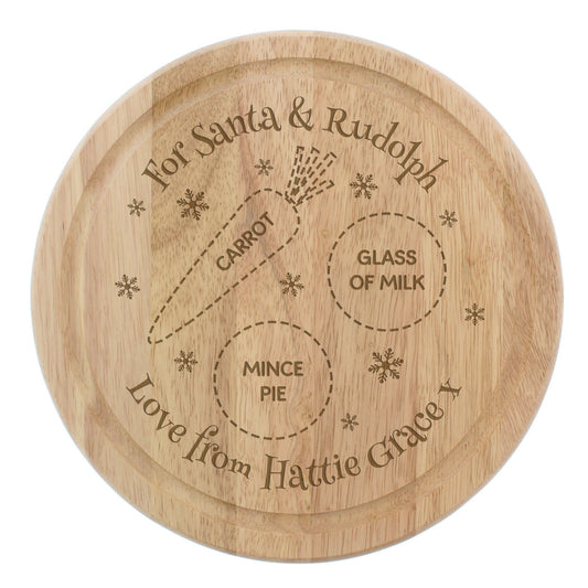 Wooden plate with engraved text for Santa and Rudolph, including a diagram of a reindeer's diet.
