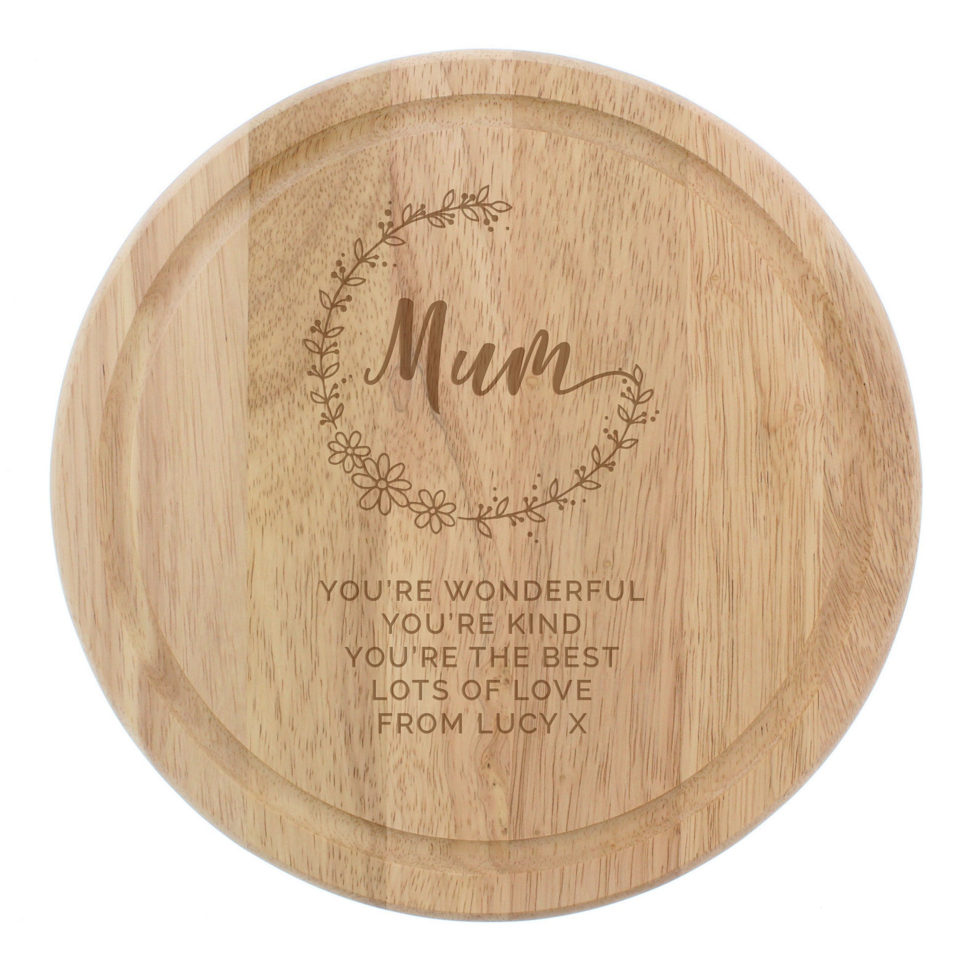 Wooden round tray with engraved message and floral design on a white background