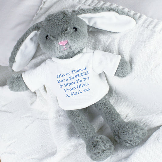 Personalised Grey plush bunny with a white shirt displaying baby birth details on a white blanket