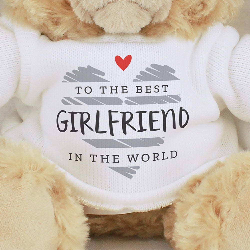 Teddy bear wearing a sweater with a message to the best girlfriend in the world