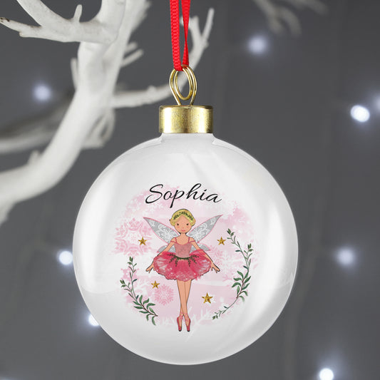 Decorative Christmas ball ornament with a fairy design and the name 'Sophia' on a dark background.