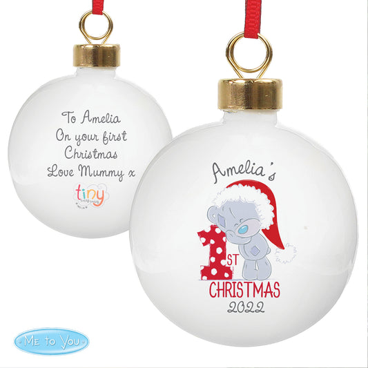 Christmas ornament with text and a teddy bear design on a white background