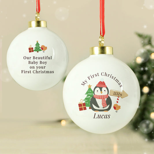 Two Personalised Christmas ornaments with festive designs and text on a neutral background.