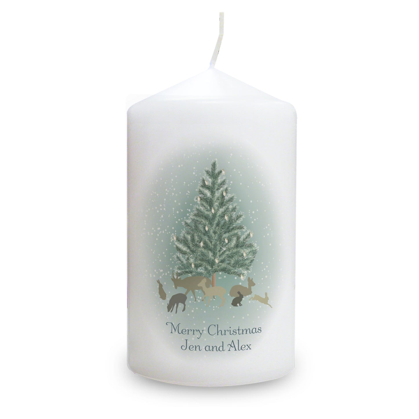 White candle with Christmas design featuring trees and reindeer on a white background