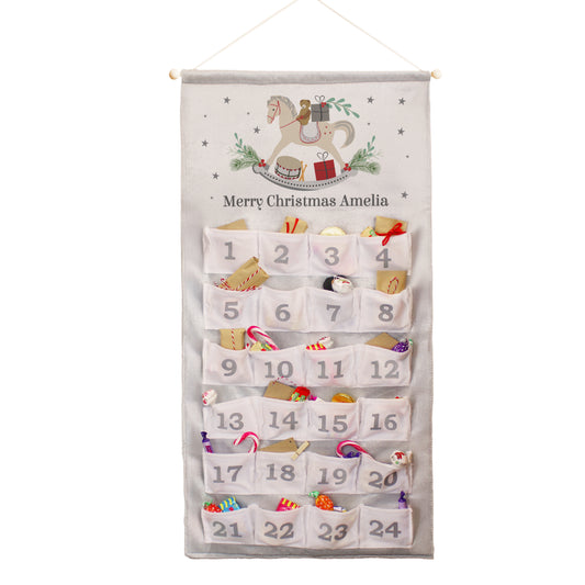 Personalised Christmas advent calendar with festive design and numbered pockets.