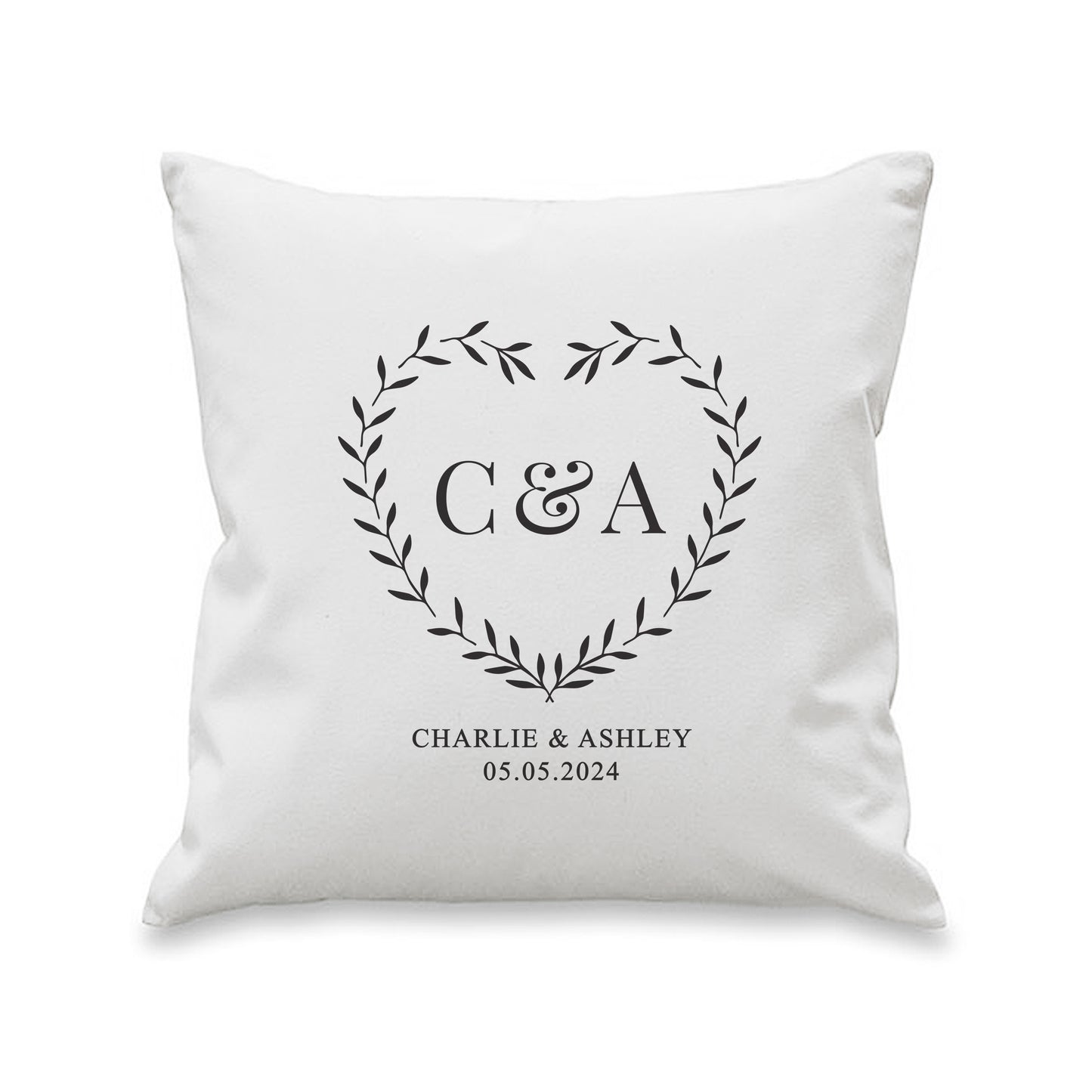 White pillow with monogram 'C&A' and text on a white background