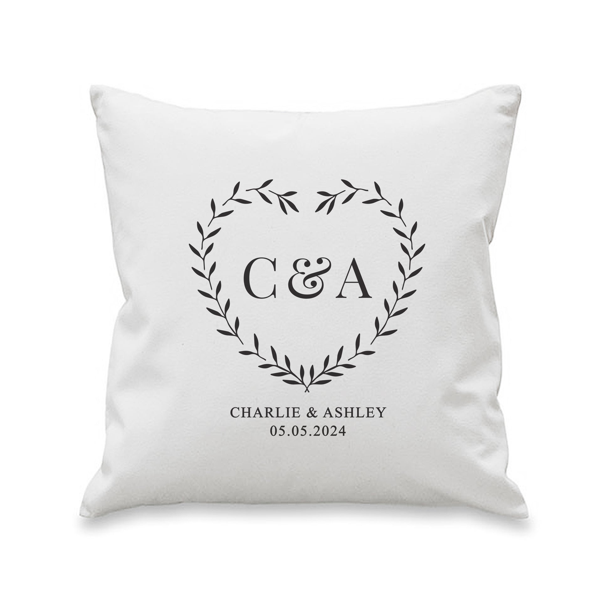 White pillow with monogram 'C&A' and text on a white background