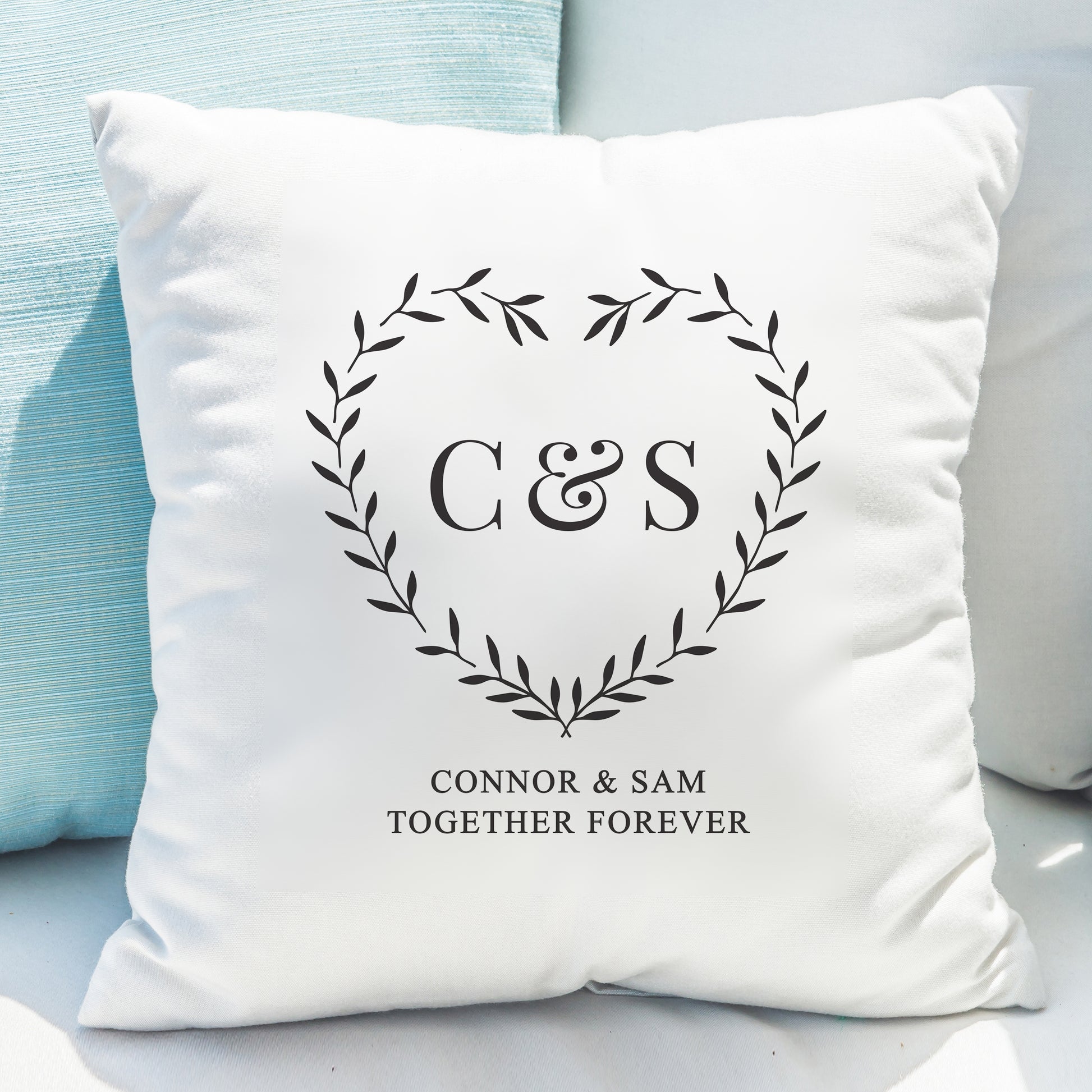 White pillow with 'C & S Connor & Sam Together Forever' design on a light blue background