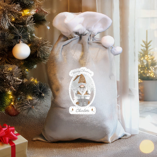 Personalised Decorative sack with a Christmas design next to a Christmas tree and presents.